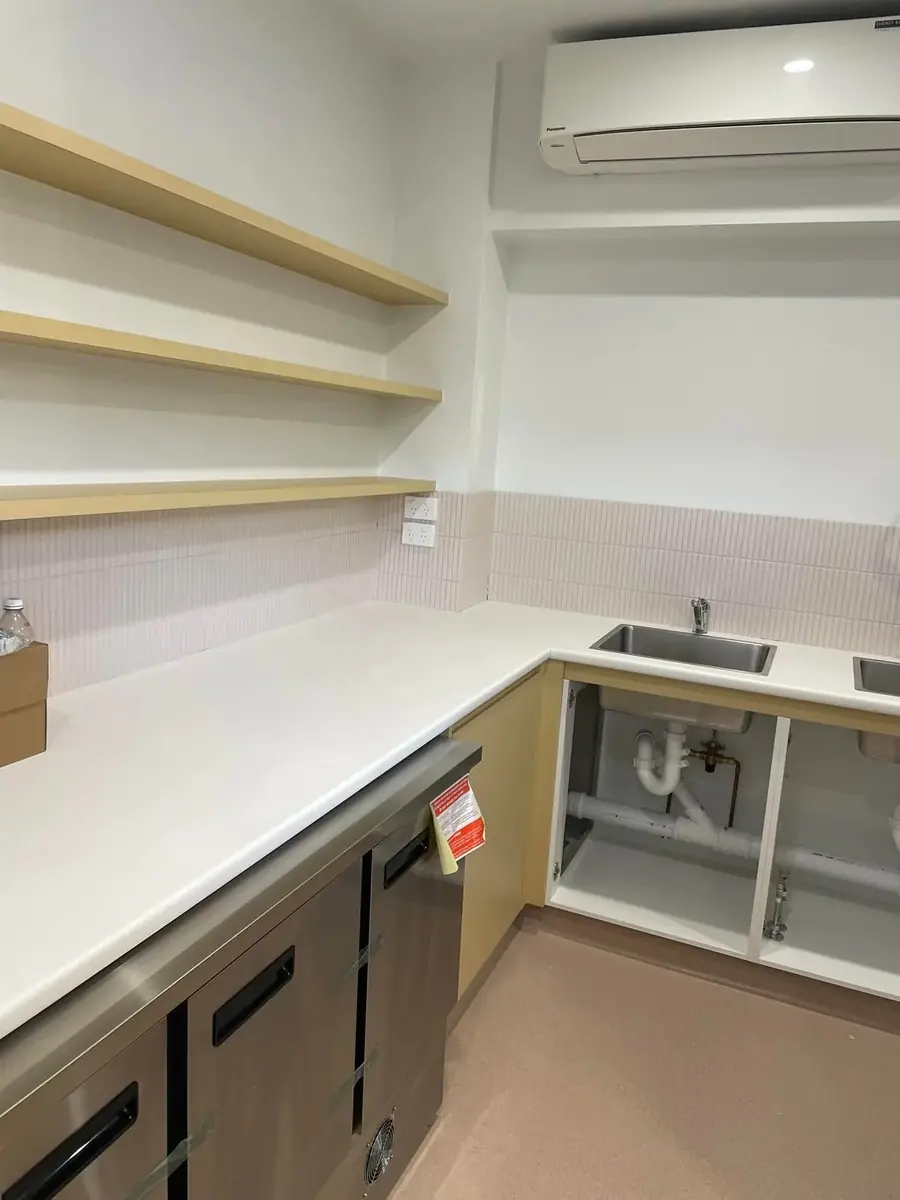 Freshly fitted sink and benchtop area in a clean interior